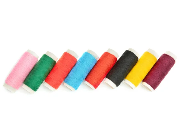 Color sewing threads on white background — Stock Photo, Image