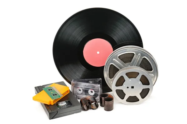 Vinyl record, video and audio cassettes isolated on white backgr — Stock Photo, Image