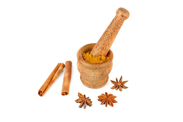 Mortar and pestle, cinnamon and star anise on white background. — Stock Photo, Image