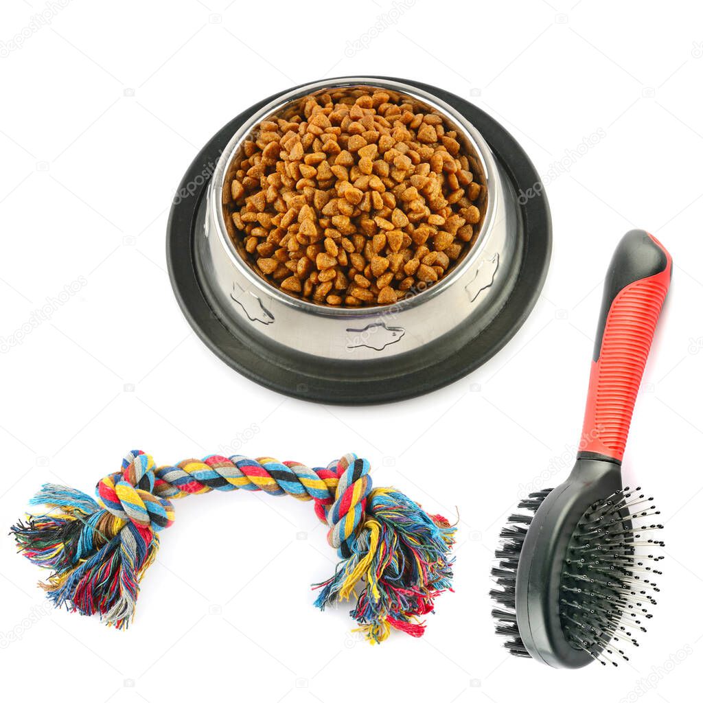 Pet accessories concept. Dry food and toys for pet on isolated white background.