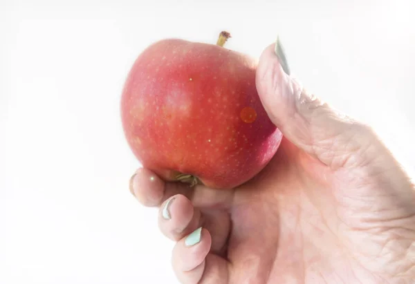 Female Hand Hold Red Apple Contrast Colored Nail Polish Close — Stock Photo, Image