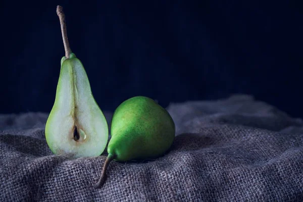 Organic Green Pears Hessian Texture Front Black Background Close Still — Stock Photo, Image