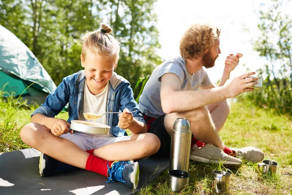 Happy Boy Eating Porridge His Father Sitting Next Him Ground — Stock Photo, Image