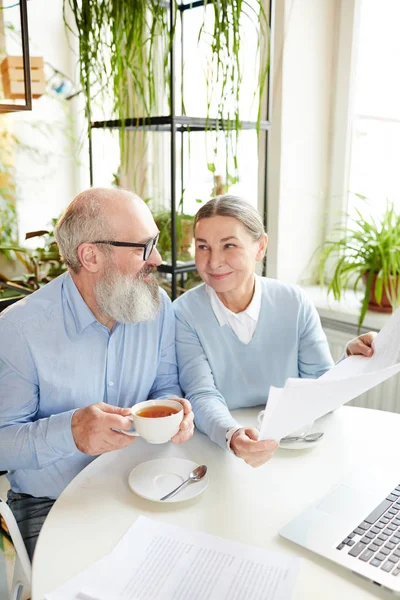 Mature Couple Discussing Papers Cup Tea While Sitting Table Cafe — Stock Photo, Image