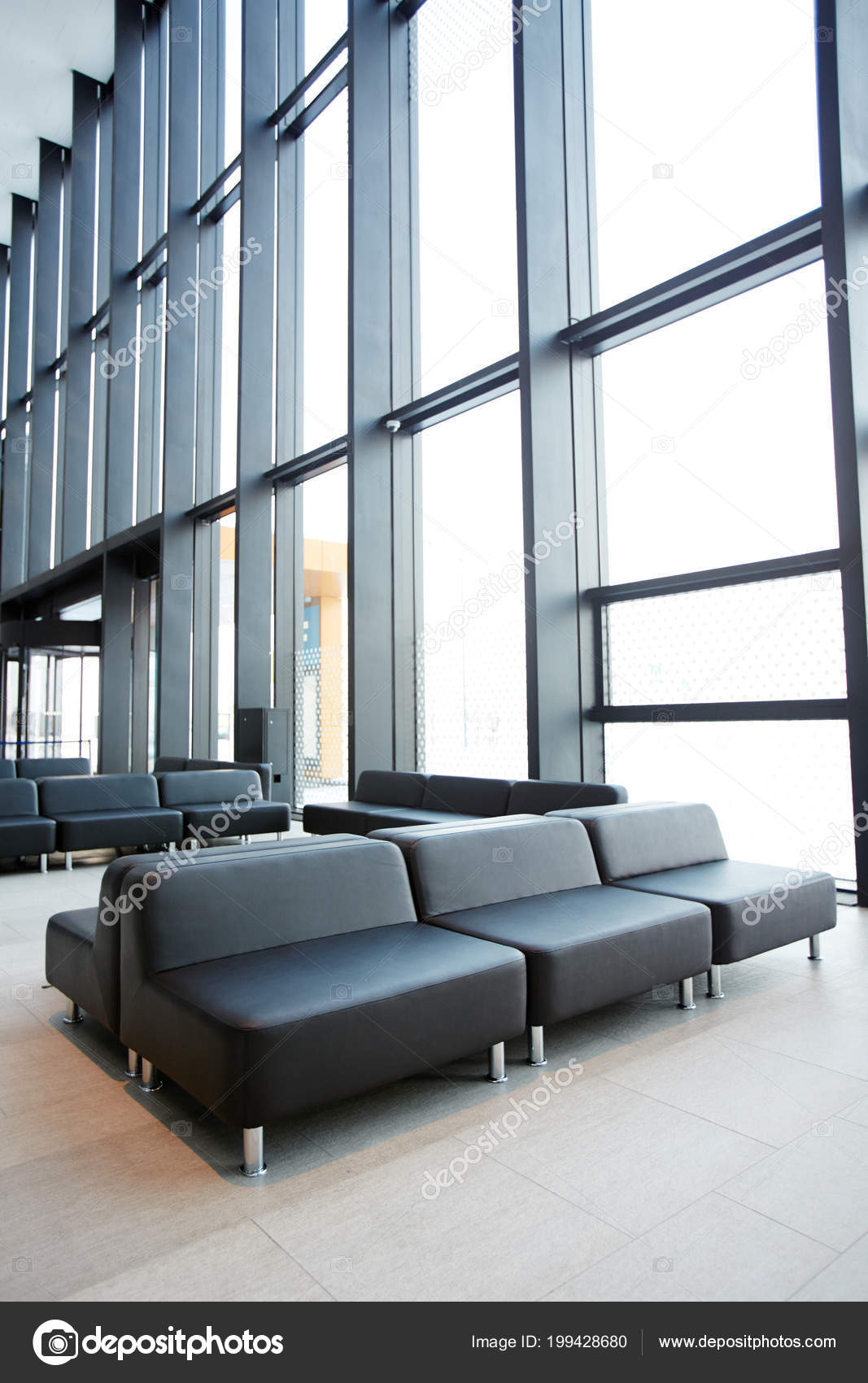 Rows Black Leather Seats Sofas Large Windows Waiting Area Rows Black Leather Seats Sofas Large Windows Waiting Area
