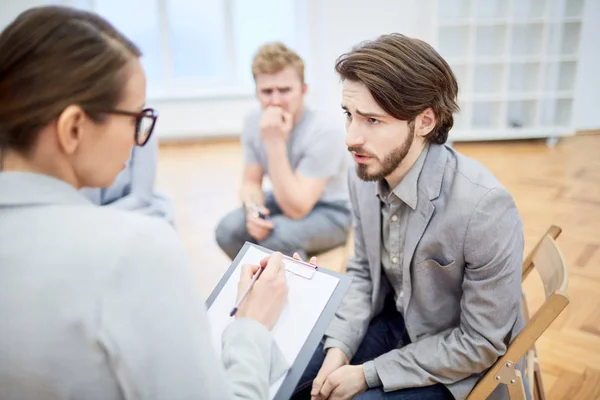 Troubled Young Businessman Explaining His Problem Counselor Group Session — Stock Photo, Image