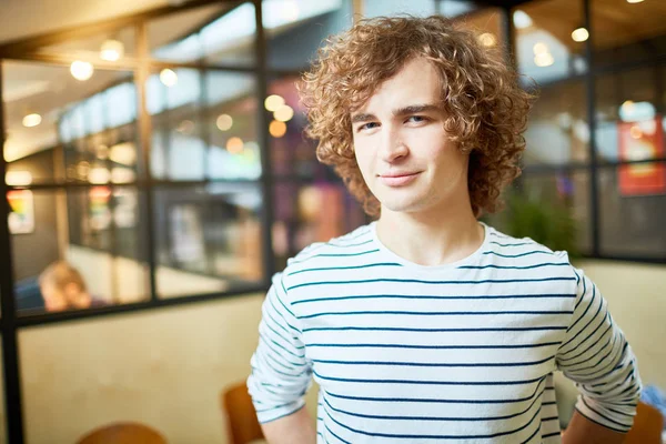 Young Employee Curly Hair Looking You Smile While Working His — Stock Photo, Image