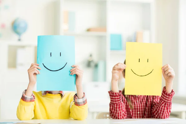 Schoolboy Schoolgirl Holding Papers Drawn Smiles Front Them Expressing Positivity — Stock Photo, Image