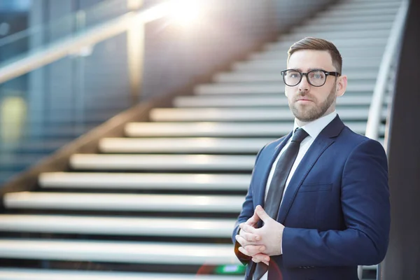 Young Businessman Suit Eyeglasses Looking Camera Background Staircase Airport — Stockfoto