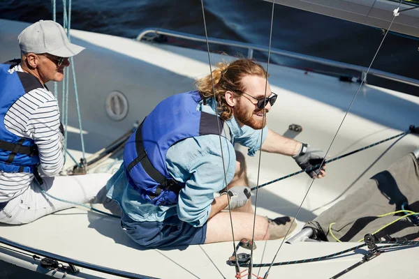 Happy Excited Young Bearded Yachtsman Sunglasses Handling Sailboat Pulling Rope — Stock Photo, Image