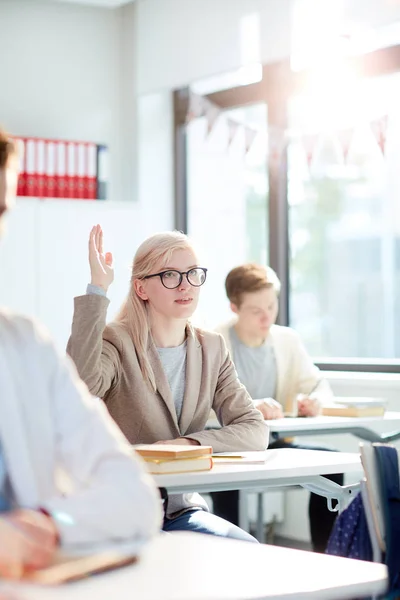 Young Blond Student Raising Her Hand Ask Question Teacher Lesson — 스톡 사진