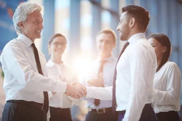 Young Mature Businessmen Greeting One Another Handshake Group Colleagues Background — Stock Photo, Image
