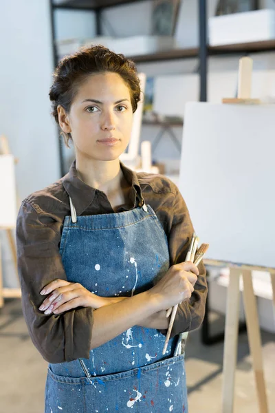 Serious Young Female Artist Paintbrushes Crossing Her Arms Chest Work — Stock Photo, Image