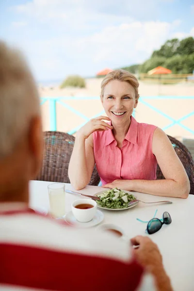 Happy Mature Female Sitting Served Table Beach Talking Man Breakfast — Stock Photo, Image