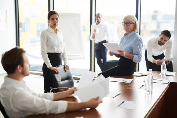 Female Economists Looking One Colleagues While Discussing Financial Papers Meeting — Stock Photo, Image