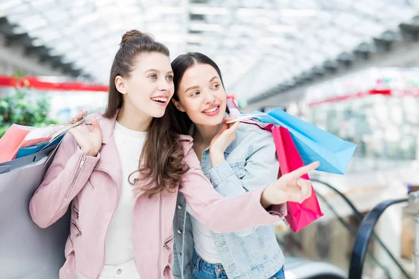 One Girlfriends Pointing Bright Collection Trendy Clothes Shopping Window Mall — Stock Photo, Image