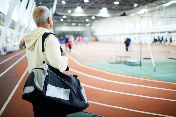 Active Senior Man Big Sportsbag Standing Stadium Looking Playing Field — Stock Photo, Image