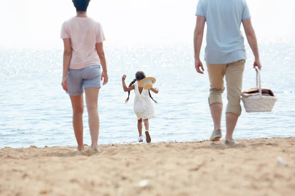 Rear View Portrait Cute Little Girl Running Sea While Enjoying — Stock Photo, Image