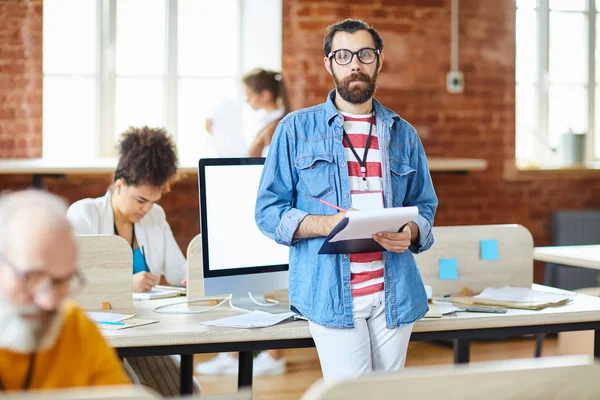 Serious Young Bearded Analyst Making Notes Document While Reading Working — Stock Photo, Image