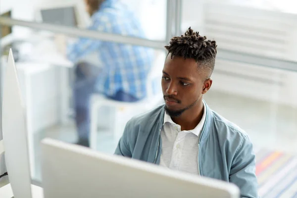 Young African American Businessman Sitting Front Two Computer Monitors Analyzing — Stock Photo, Image