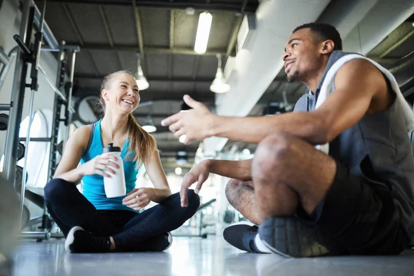 Laughing Girl Having Water While Listening African American Guy Break — Stock Photo, Image