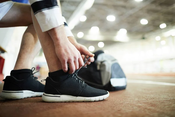 Contemporary Sportsman Tying Shoelaces Sneakers While Preparing Training Stadium — Stock Photo, Image