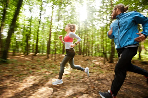 Young Active Man His Girlfriend Jogging Out Forest Sunny Day — 스톡 사진