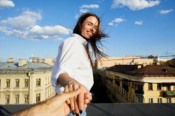 Happy Young Woman Holding Someone Hand Offering Come Roof Edge — Stock Photo, Image