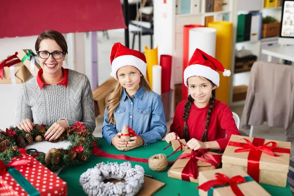 Happy Little Santa Girls Pretty Mother Looking You While Preparing — стоковое фото