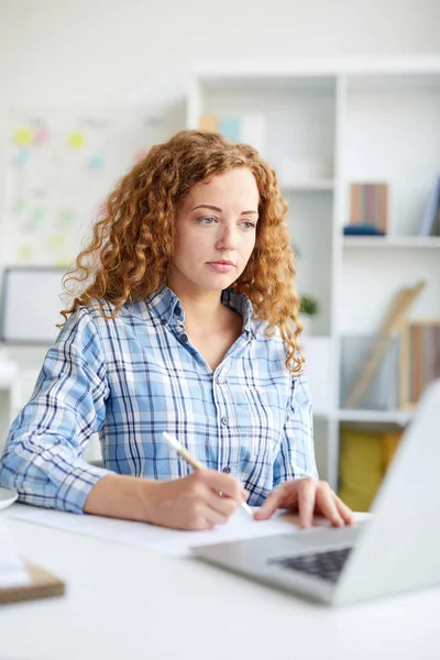 Young Attractive Financier Making Notes Paper While Sitting Workplace Looking — 스톡 사진