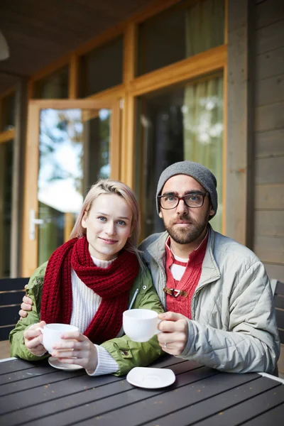 Portrait Young Attractive Caucasian Couple Sitting Wooden Table Terrace Holding — Stock Photo, Image