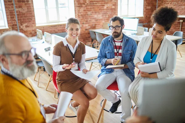 Group Young Managers Making Notes While Listening Mature Experienced Coach — Stock Photo, Image