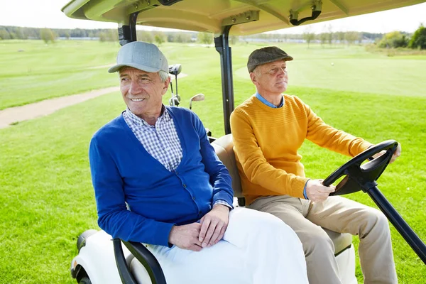Two Senior Buddies Sitting Golf Car While One Them Driving — Stock Photo, Image