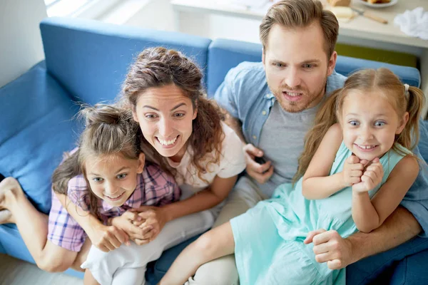 Young Parents Little Girls Tense Facial Expression Sitting Sofa Front — Stock Photo, Image