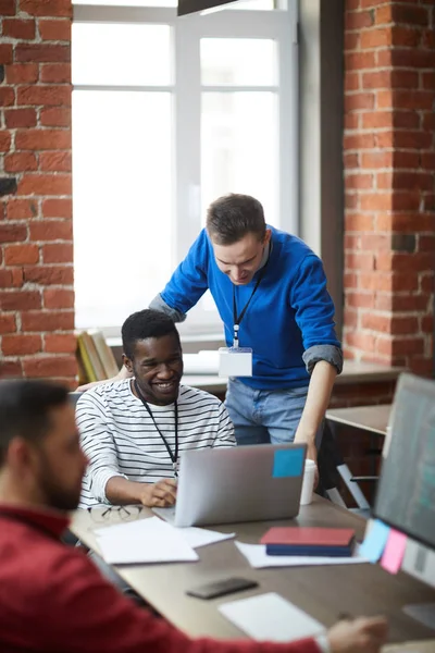 Two Young Analysts Designers Looking Laptop Display While Looking Online — Stock Photo, Image