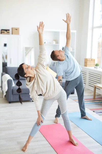 Young Active Man Woman Standing Floor Left Arms Raised Home — 스톡 사진