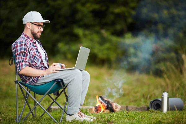 Young Man Sitting Chair Typing Laptop Campfire Forest — Stock Photo, Image