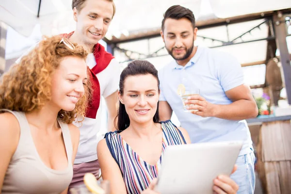 Young Friends Tablet Looking Its Display While Spending Time Together — Stock Photo, Image