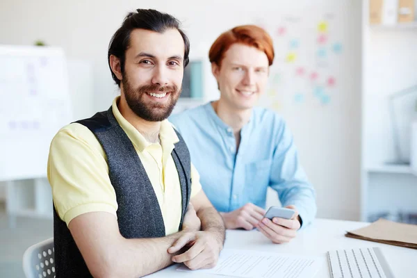 Happy Young Office Worker His Colleague Looking Camera Workplace — Stock Photo, Image