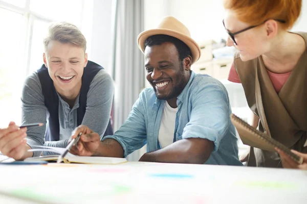 Young Joyful Designers Laughing Some Ideas While Discussing Them Working — Stock Photo, Image