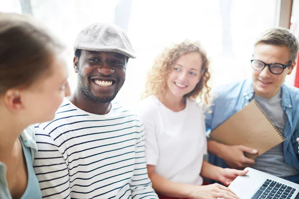 Young Laughing African American Man Toothy Smile His Groupmates Looking — 스톡 사진