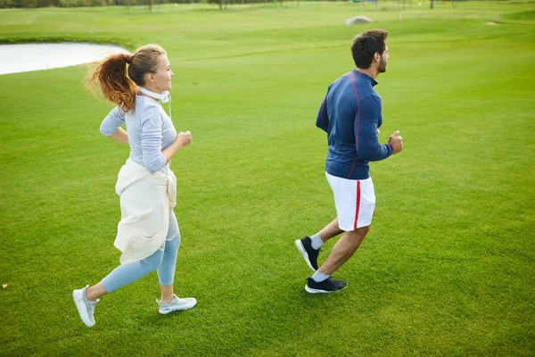 Active Young Man Woman Running Green Grass Rural Environment Park — Stock Photo, Image