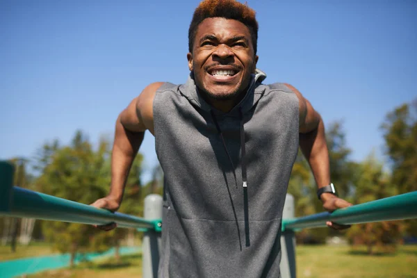 Aggressive Emotional Handsome Young Black Man Clenched Teeth Doing Dips — Stock Photo, Image