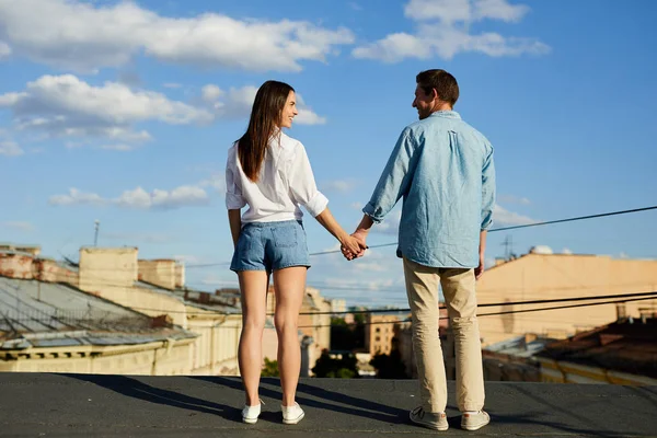 Rear View Happy Young Dates Holding Hands While Standing Roof — Stock Photo, Image