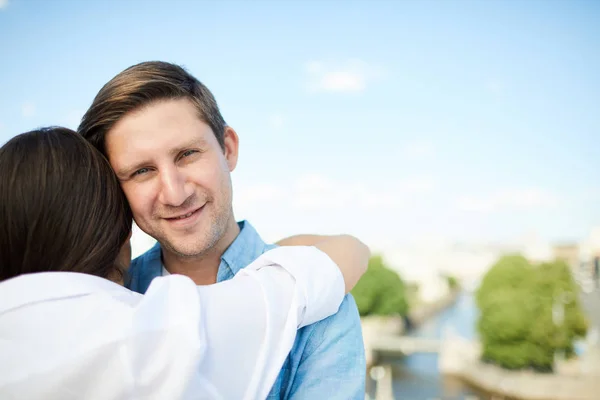 Smiling Handsome Young Man Stubble Hugging Girlfriend Looking Camera While Royalty Free Stock Images