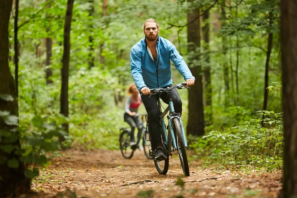 Active Guy Sportswear Cycling Forest Path Summer Day His Girlfriend — Stock Photo, Image
