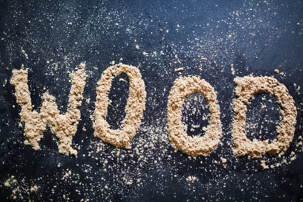 Close Van Woord Hout Gemaakt Van Zaagsel Zwarte Achtergrond Werkruimte — Stockfoto