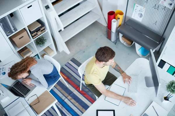 Young Programmer Sitting Front Computer Monitor Working While His Colleague — Stock Photo, Image