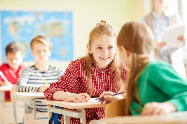 Positive Pretty Classmates Casual Clothing Sitting Desks Talking Each Other — Stock Photo, Image