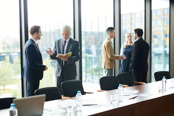 Two Small Groups Teammates Standing Conference Hall Preparing Reports — Stock Photo, Image